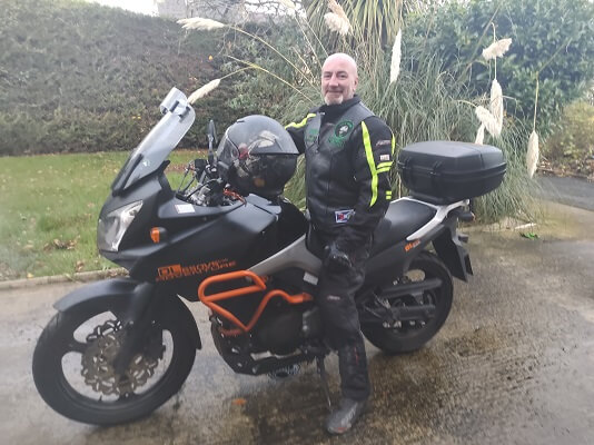 Taco sitting on his Vstrom Motorcyle